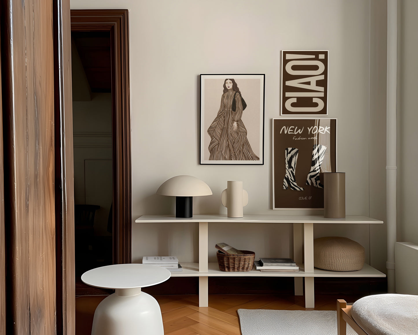Modern interior with a shelf displaying decor items and framed pictures.