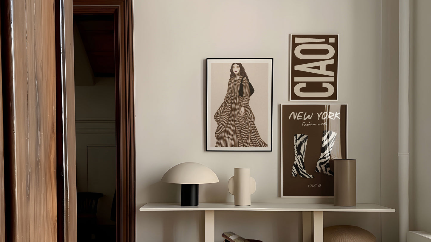 Modern interior with a shelf displaying decor items and framed pictures.